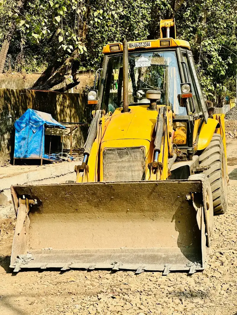 JCB backhoe loader with front bucket and bolt-on teeth
